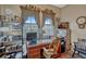 Bright office space with wooden desk, shelving and lots of natural light at 200 Valencia Ridge Dr, Auburndale, FL 33823