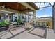 Cozy patio with cushioned seating, a porch swing, and a wrought-iron bench, creating a perfect space for relaxation at 200 Valencia Ridge Dr, Auburndale, FL 33823