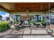 Inviting covered patio with comfortable seating and dining areas, perfect for outdoor relaxation and entertainment at 200 Valencia Ridge Dr, Auburndale, FL 33823