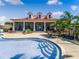 Resort-style community pool with an inviting clubhouse and plenty of seating at 200 Valencia Ridge Dr, Auburndale, FL 33823