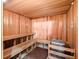Wooden sauna room with benches and a heater for a relaxing spa-like experience at 200 Valencia Ridge Dr, Auburndale, FL 33823