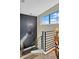 Modern staircase features high ceilings, large wall clock and accent wall paint at 200 Valencia Ridge Dr, Auburndale, FL 33823