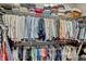 Organized walk-in closet featuring shelves and hanging rods perfect for clothes storage and organization at 200 Valencia Ridge Dr, Auburndale, FL 33823
