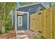 Side yard with a new fence and brick patio leading to the house entrance at 2004 E Marks St, Orlando, FL 32803