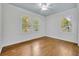 Bright bedroom featuring wood floors and large windows offering ample natural light at 2004 E Marks St, Orlando, FL 32803