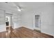 Bright living room boasts hardwood floors and built-in shelving for ample storage space at 2004 E Marks St, Orlando, FL 32803