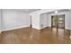 Hardwood floors accent this living room space, complemented by white walls and an archway feature at 2004 E Marks St, Orlando, FL 32803