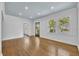 Bright living room featuring gleaming hardwood floors, fresh white walls, and ample natural light at 2004 E Marks St, Orlando, FL 32803