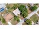 This aerial view showcases a lovely home nestled among mature trees in a quiet neighborhood at 2025 Claremont Dr, Deltona, FL 32725