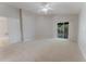 Large bedroom featuring soft carpeting and bright sliding glass doors at 2025 Claremont Dr, Deltona, FL 32725