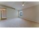 Spacious bedroom with large window and neutral carpet at 2025 Claremont Dr, Deltona, FL 32725