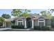 Charming single-story home featuring a well-manicured lawn, inviting front door, and attached two-car garage at 2025 Claremont Dr, Deltona, FL 32725