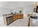 Well-maintained kitchen with ample counter space, stainless steel appliances, and tiled flooring at 2025 Claremont Dr, Deltona, FL 32725