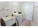 Functional laundry room with a utility sink, shelving, and washer and dryer at 2025 Claremont Dr, Deltona, FL 32725