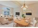 Open-concept living room and dining area with plenty of natural light and comfortable seating at 2025 Claremont Dr, Deltona, FL 32725