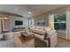 Comfortable living room with a ceiling fan, large window, and neutral tones at 2025 Claremont Dr, Deltona, FL 32725