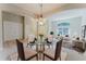 Bright living room, dining room and neutral carpet flooring at 2025 Claremont Dr, Deltona, FL 32725