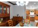 Cozy dining area with a glass-front hutch and table with chairs near kitchen at 20951 County Road 561, Clermont, FL 34715