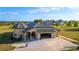 Charming home with a three car garage, and a beautiful tile roof, on a well-manicured lot at 20951 County Road 561, Clermont, FL 34715