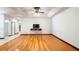 Open-concept living room featuring hardwood flooring, bright natural light, and recessed ceiling at 20951 County Road 561, Clermont, FL 34715