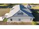 Tile roof detailing with manicured garden area and custom pergola featuring turf at 20951 County Road 561, Clermont, FL 34715