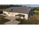 The home features a shaded patio area, perfect for relaxation and entertaining, plus an expansive yard at 20951 County Road 561, Clermont, FL 34715