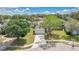 Aerial view of home with lush landscaping, mature trees, and a well-maintained lawn at 2381 Pinebrook Ct, Oviedo, FL 32766