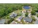 Aerial view of neighborhood homes and a nearby lake at 2381 Pinebrook Ct, Oviedo, FL 32766