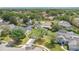 Real estate listing showcasing the property and surrounding neighborhood from an aerial perspective at 2381 Pinebrook Ct, Oviedo, FL 32766