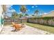 Landscaped backyard with a stone fire pit and seating, perfect for entertaining outdoors at 2381 Pinebrook Ct, Oviedo, FL 32766