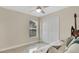 Well-lit bedroom with ceiling fan, and closet at 2381 Pinebrook Ct, Oviedo, FL 32766