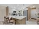 Modern kitchen features a breakfast bar with seating and stainless steel appliances at 2381 Pinebrook Ct, Oviedo, FL 32766