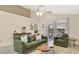 Cozy living room with a ceiling fan and sliding glass doors leading to an outdoor patio at 2381 Pinebrook Ct, Oviedo, FL 32766