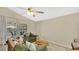 Cozy living room with ceiling fan, an accent rug and sliding glass doors to the patio at 2381 Pinebrook Ct, Oviedo, FL 32766