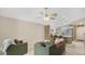 Open-concept living space adjacent to kitchen with neutral color palette and ceiling fan at 2381 Pinebrook Ct, Oviedo, FL 32766