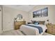 Comfortable main bedroom featuring modern mountain art, rustic furniture, and a neutral color palette at 2381 Pinebrook Ct, Oviedo, FL 32766