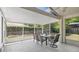 Screened lanai with dining area for outdoor living and entertaining at 2381 Pinebrook Ct, Oviedo, FL 32766