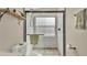 The tiled shower stall features a window and a pebble floor, offering a spa-like experience at 2381 Pinebrook Ct, Oviedo, FL 32766