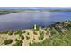 Stunning aerial view of the property showcasing its lakeside location at 2519 Gabriel Rd, Fort Meade, FL 33841