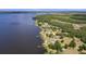 Aerial view of lakefront property with private dock and lush green surroundings at 2519 Gabriel Rd, Fort Meade, FL 33841