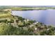 Waterfront property with lake access, nestled among lush greenery and mature trees at 2519 Gabriel Rd, Fort Meade, FL 33841