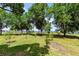 Scenic backyard with mature trees and a tranquil view of the water at 2519 Gabriel Rd, Fort Meade, FL 33841
