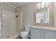 Bathroom with gray mosaic tile accent wall, shower and white vanity with marble countertop at 2519 Gabriel Rd, Fort Meade, FL 33841