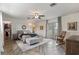 Spacious bedroom with wood flooring, a ceiling fan, and French doors leading to the outside at 2519 Gabriel Rd, Fort Meade, FL 33841