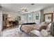 Bright bedroom featuring wood floors, a ceiling fan, and cozy decor at 2519 Gabriel Rd, Fort Meade, FL 33841