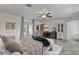 Comfortable bedroom featuring wood floors, a ceiling fan, and cozy décor at 2519 Gabriel Rd, Fort Meade, FL 33841
