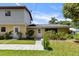 Front exterior of the home with lovely plants, stone pathway, and well-manicured grass at 2519 Gabriel Rd, Fort Meade, FL 33841