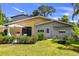 Inviting home exterior with a patio, lush greenery, and a charming fire pit area at 2519 Gabriel Rd, Fort Meade, FL 33841