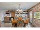 Kitchen with wood countertops, stainless appliances, a chandelier, and brick accents add to the cozy atmosphere at 2519 Gabriel Rd, Fort Meade, FL 33841