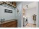Laundry room with modern washer and dryer, storage cabinets, and stylish decor at 2519 Gabriel Rd, Fort Meade, FL 33841